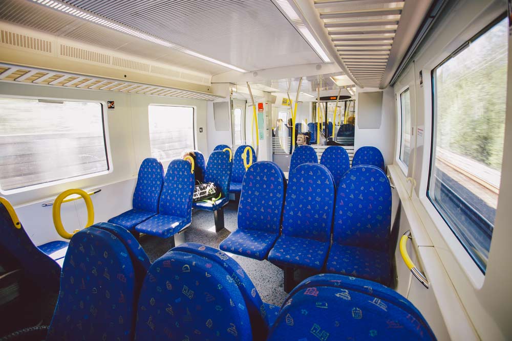 Classic blue seats on a commuter train in Sweden.
