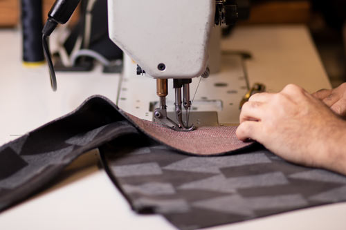 Stitching fabric with a modern sewing machine.